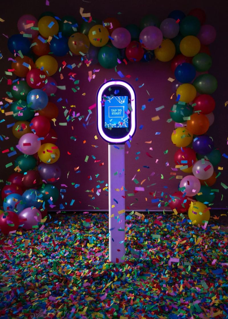 A self-serve digital photo booth kiosk at a reception
